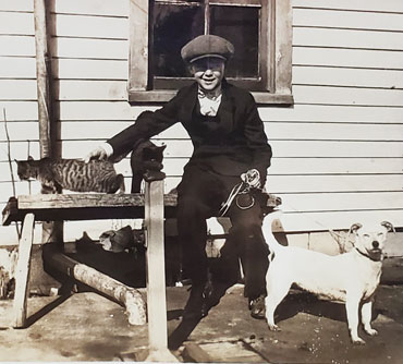 Lawrence Alfred Lucas with cats and dog