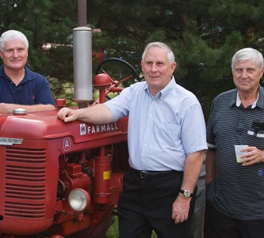 Larry, Jerry and Tom Lucas w/Farmall A tractor - 2006