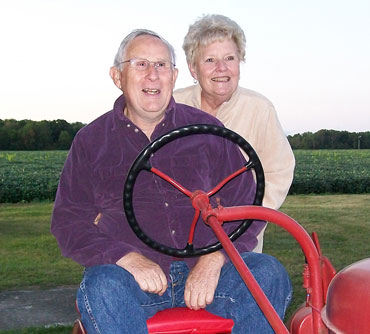 Jerry and Geraldine Schmeltz on Farmall A tractor 2009